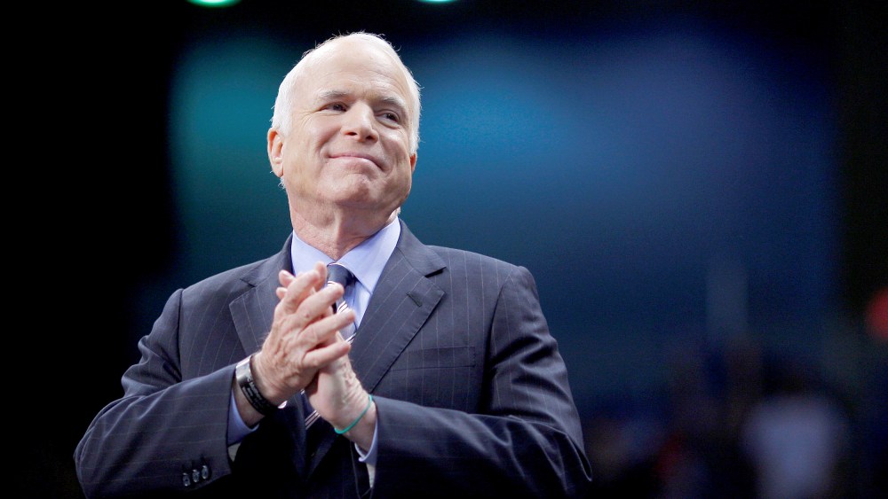 FILE PHOTO - U.S. Republican presidential nominee Senator John McCain listens as he is introduced at a campaign rally in Fayetteville