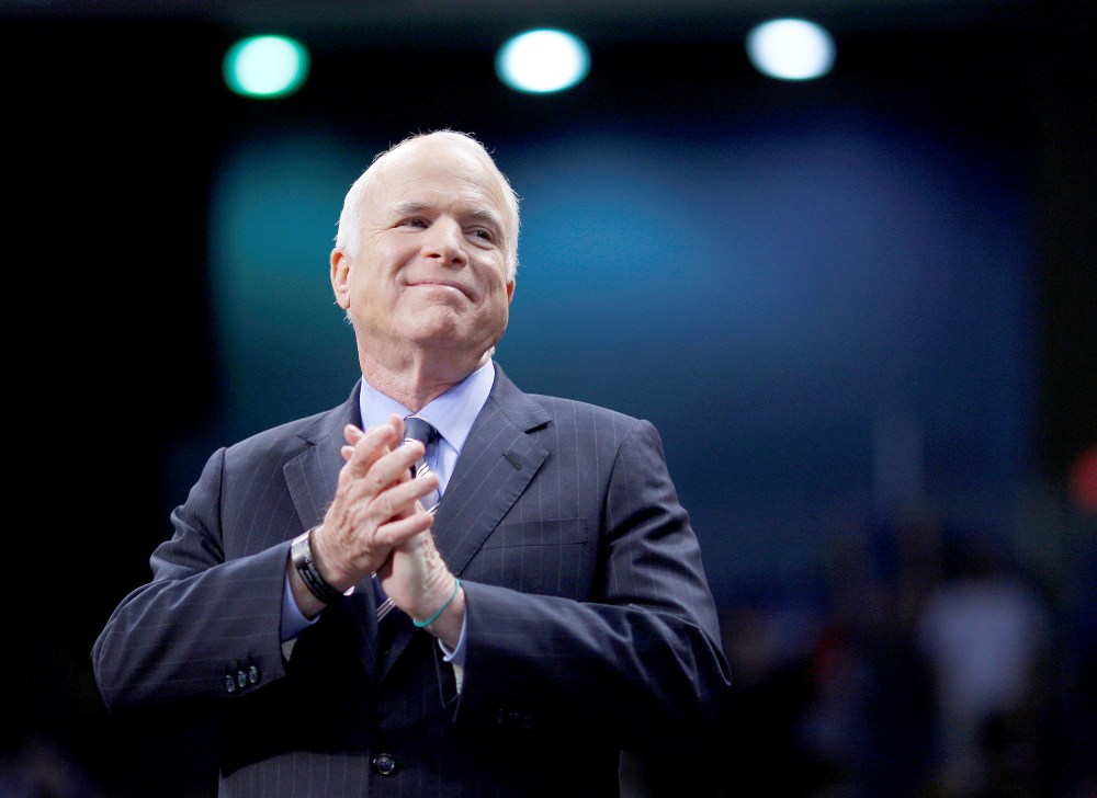FILE PHOTO - U.S. Republican presidential nominee Senator John McCain listens as he is introduced at a campaign rally in Fayetteville