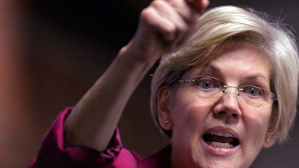 Massachusetts Senator Elizabeth Warren speaks to a rally of supporters of Kentucky senatorial candidate Alison Lundergan Grimes in Louisville, Ky., on Oct. 28, 2014. (Timothy D. Easley/AP)