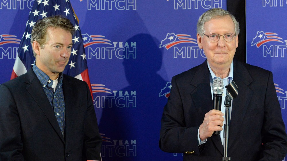 Kentucky Senators Mitch McConnell, left, and Rand Paul address the media during a press conference, May 23, 2014, in Louisville, Ky.