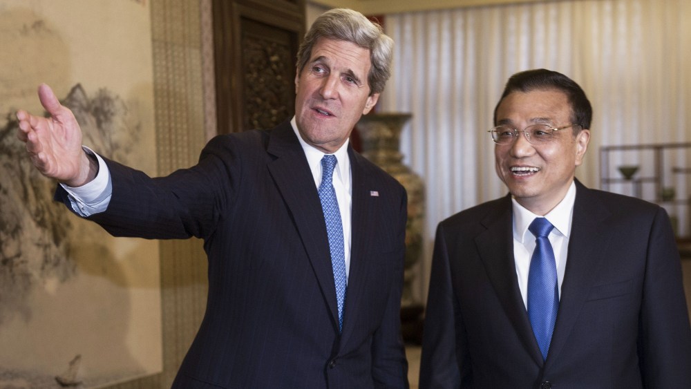 US Secretary of State John Kerry(L) and and Chinese Premier Li Keqiang shake hands shortly before conducting a  private bilateral meeting at the Zhongnanhai Leadership Compound April 13, 2013, in Beijing, China.        AFP POOL Photo/Paul J. Richards  ...