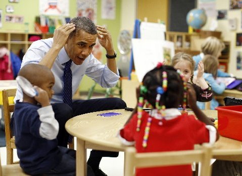 U.S. President Barack Obama plays a game with children in a pre-kindergarten classroom at College Heights early childhood learning center in Decatur February 14, 2013. Obama flew to Georgia to push his plan to ensure high-quality preschool, unveiled...