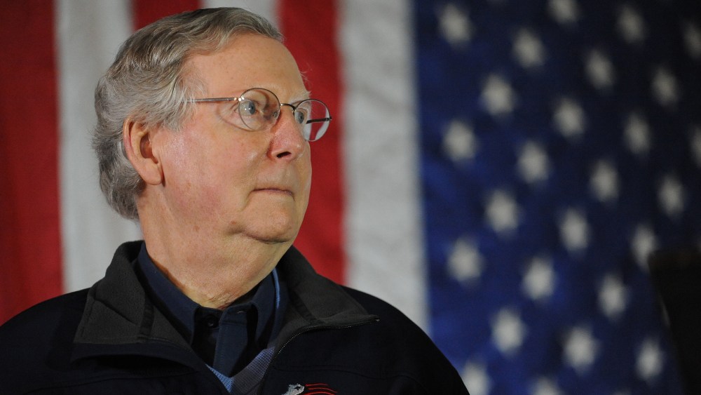 Sen. Mitch McConnell, R-Ky., waits to speak during a campaign stop at Badgett Supply in Madisonville, Ky., Saturday, Feb. 8, 2014.