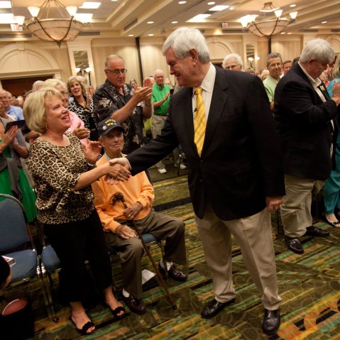 Republican presidential candidate Newt Gingrich greets supporters at the Naples Hilton in Naples, Fla., Friday, Nov. 25, 2011.