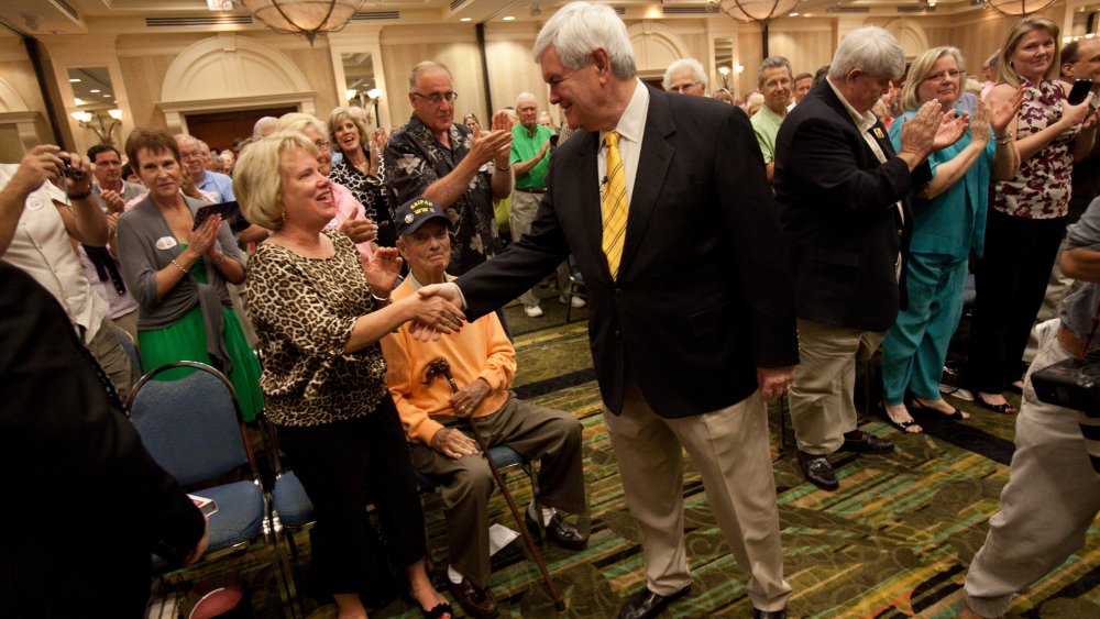 Republican presidential candidate Newt Gingrich greets supporters at the Naples Hilton in Naples, Fla., Friday, Nov. 25, 2011.