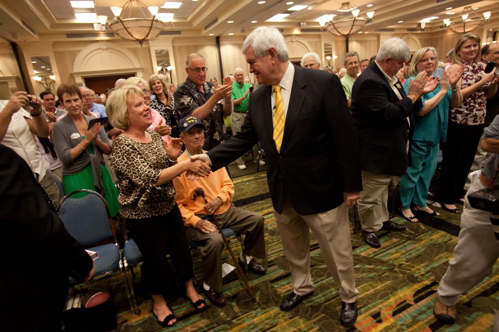 Republican presidential candidate Newt Gingrich greets supporters at the Naples Hilton in Naples, Fla., Friday, Nov. 25, 2011.