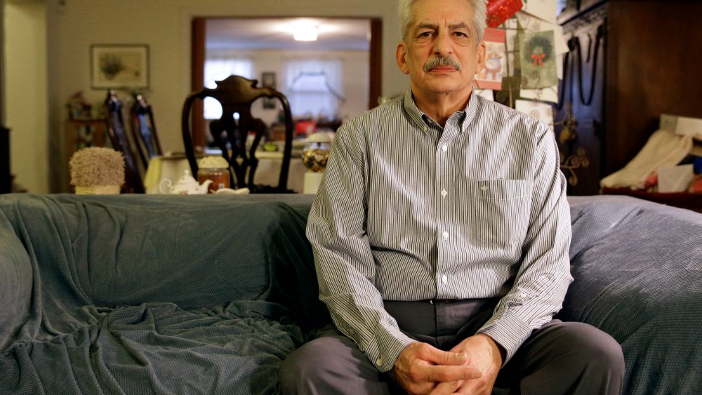 In this Jan. 10, 2014 photo, Stan Osnowitz poses in his living room in Baltimore. Osnowitz, 67, lost his state unemployment benefits of $430 a week in December.