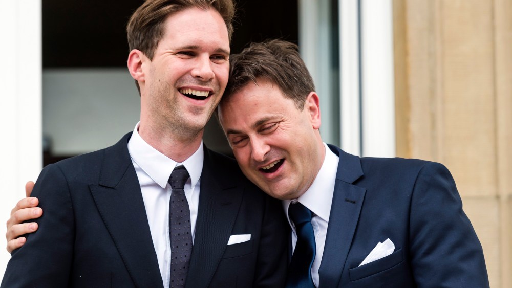 Luxembourg's Prime Minister Xavier Bettel, right, puts his hand around the shoulder of his partner Gauthier Destenay after their marriage at the town hall in Luxembourg, on May 15, 2015. (Photo by Geert Vanden Wijngaert/AP)