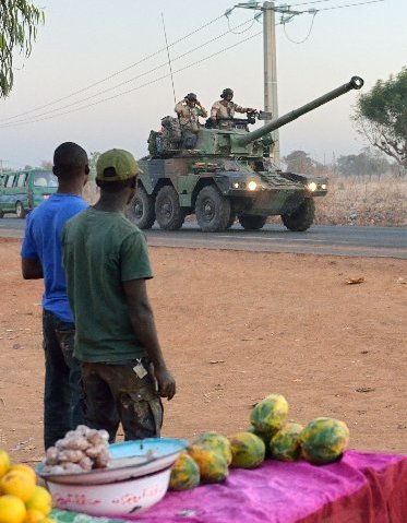 French army soldiers stand on a Sagaie tank destroyer as they leave Bamako and start their deployment to the north of Mali as part of the "Serval" operations on January 15, 2013 . France is using air and ground power in a joint offensive with Malian...