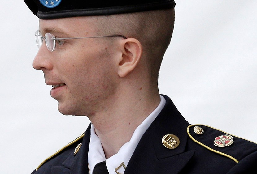 Army Pfc. Bradley Manning is escorted out of a courthouse in Fort Meade, Md., Tuesday, July 30, 2013, after receiving a verdict in his court martial. (Photo by Patrick Semansky/AP)