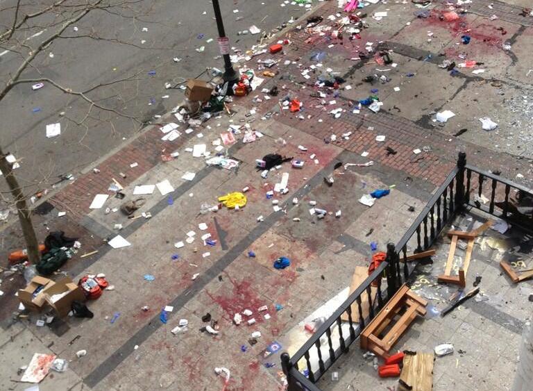 This photo provided by Bruce Mendelsohn shows the scene after two explosions occurred during the 2013 Boston Marathon in Boston, Monday, April 15, 2013. Two explosions shattered the euphoria of the Boston Marathon finish line on Monday, sending...
