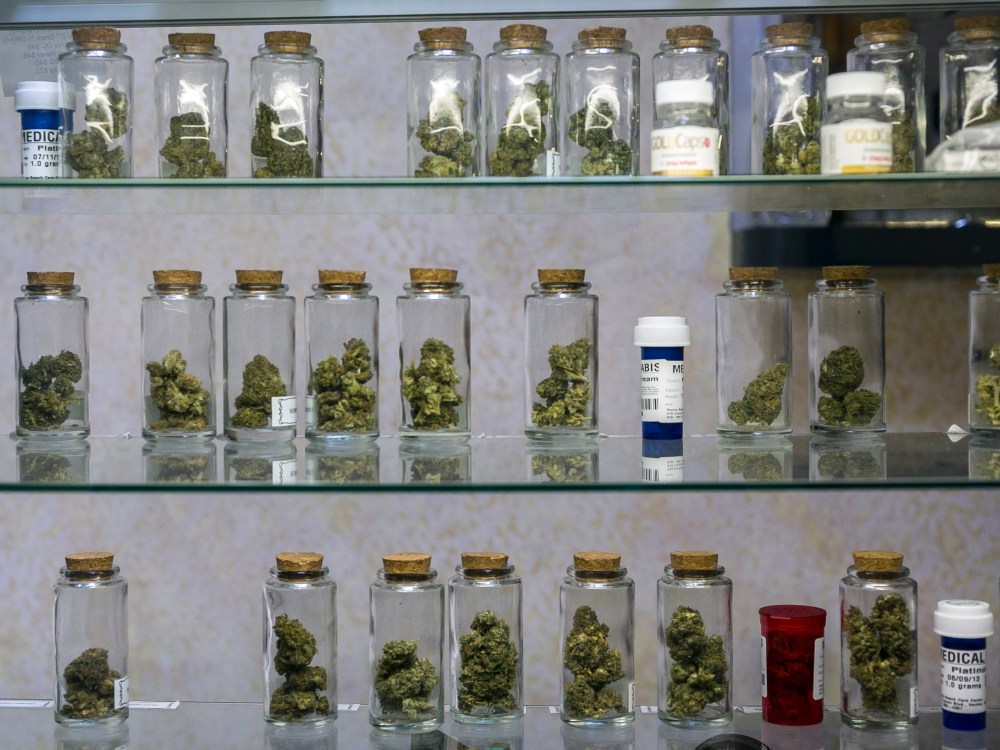 In this photo taken Tuesday, May 14, 2013, Medical marijuana vials are displayed at the Venice Beach Care Center medical marijuana dispensary in Venice, Calif.  (AP Photo/Damian Dovarganes)
