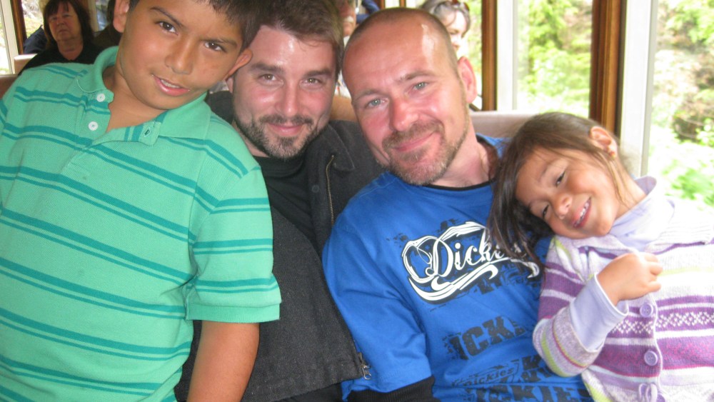 Daniel Martinez-Leffew (left) wrote a letter to Chief Justice Roberts, urging him to accept marriage equality. Shown from right to left: Daniel Martinez-Leffew, Bryan Leffew (father), Jay Foxworthy (father), Selena Leffew (sister) (Courtesy Bryan Leffew)