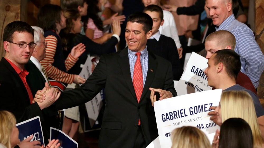 Republican candidate for the U.S. Senate, Gabriel Gomez, center, celebrates with supporters as he makes his way to the stage to address an audience with a victory speech at a watch party, in Cohasset, Mass. (AP Photo by Steven Senne/AP)