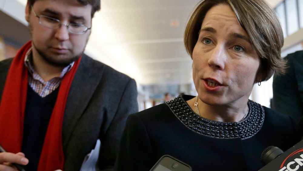 Massachusetts Attorney General Maura Healey, center, speaks with members of the media on Jan. 22, 2015, in Boston.