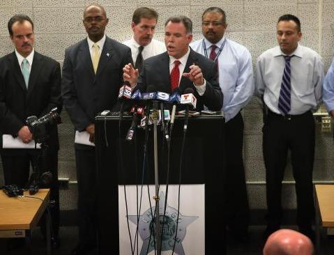 With police officers who solved the case behind him, Chicago Police Superintendant Garry McCarthy announces arrests have been made in the murder of 15-year-old Hadiya Pendleton during a press conference at Area Central on February 11, 2013 in Chicago,...