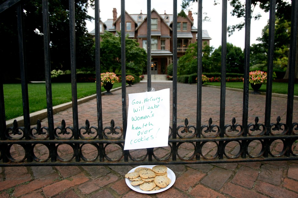 Opponents of the abortion bill that Gov. Pat McCrory signed on Monday continued their second day of protests across the street from the Executive Mansion on Tuesday, July 30, 2013. Just after 1pm, the Governor himself walked across the street to give...
