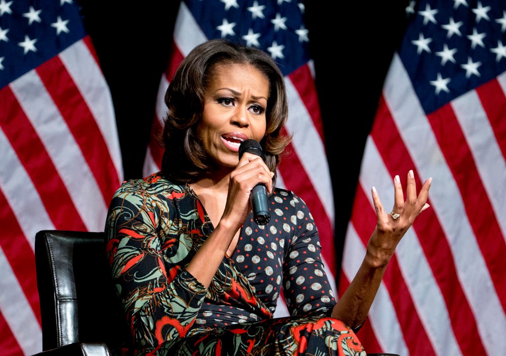 First lady Michelle Obama speaks to students about committing to education, Tuesday, Nov. 12, 2013, at Bell Multicultural High School in Washington.