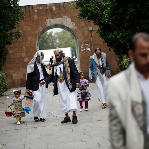 Yemenis gather after Eid al-Fitr prayers that marks the end of the holy fasting month of Ramadan on the first day of Eid al-Fitr in Sanaa, Yemen, Thursday, Aug. 8, 2013. (Photo by Hani Mohammed/AP)