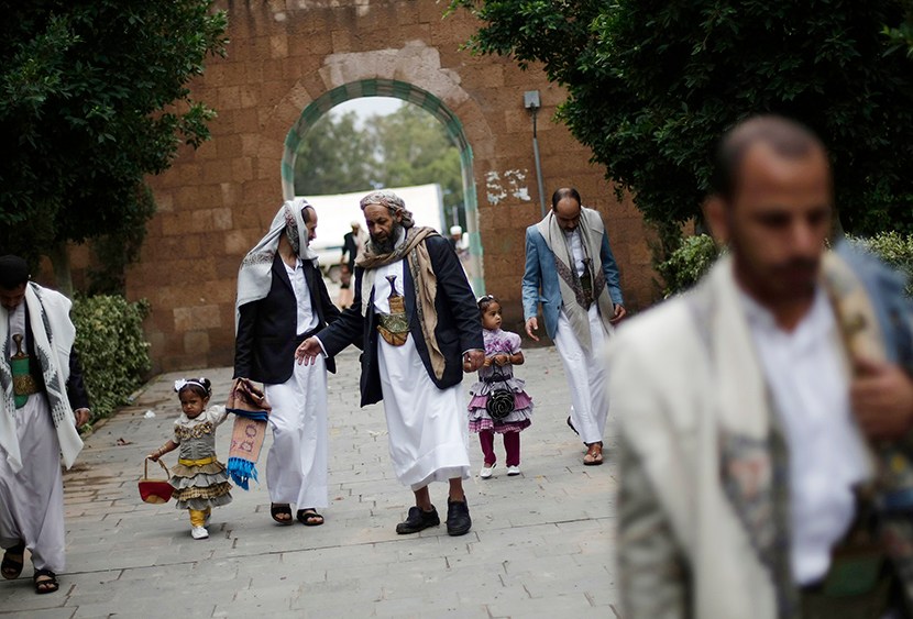 Yemenis gather after Eid al-Fitr prayers that marks the end of the holy fasting month of Ramadan on the first day of Eid al-Fitr in Sanaa, Yemen, Thursday, Aug. 8, 2013. (Photo by Hani Mohammed/AP)