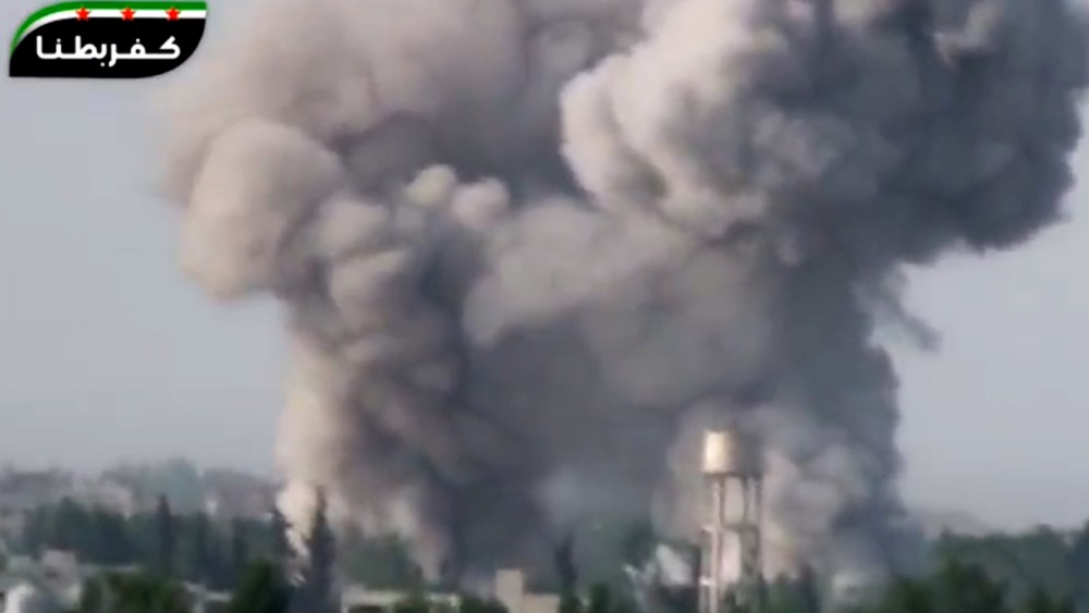In this image taken from video obtained from the Ugarit News, which has been authenticated based on its contents and other AP reporting, smoke billows from a government airstrike on the Ghouda area of Damascus, Syria, Friday, May 3, 2013. Syria's main...