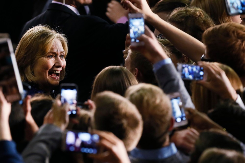 Former U.S. Secretary of State Hillary Rodham Clinton greets supporters at a rally for U.S. Senate candidate Gary Peters and gubernatorial candidate Mark Schauer at Oakland University in Auburn Hills, Mich. on Oct. 16, 2014.