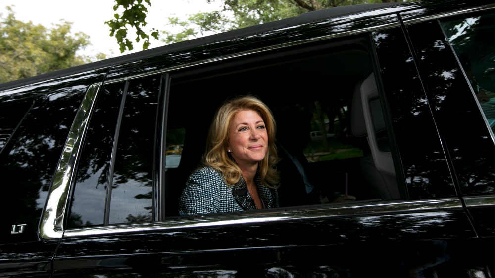 Democratic Texas gubernatorial candidate Wendy Davis leaves the Austin, Texas home of Jim Bryce where she gave a pep talk to campaign volunteers on Nov. 3, 2014.