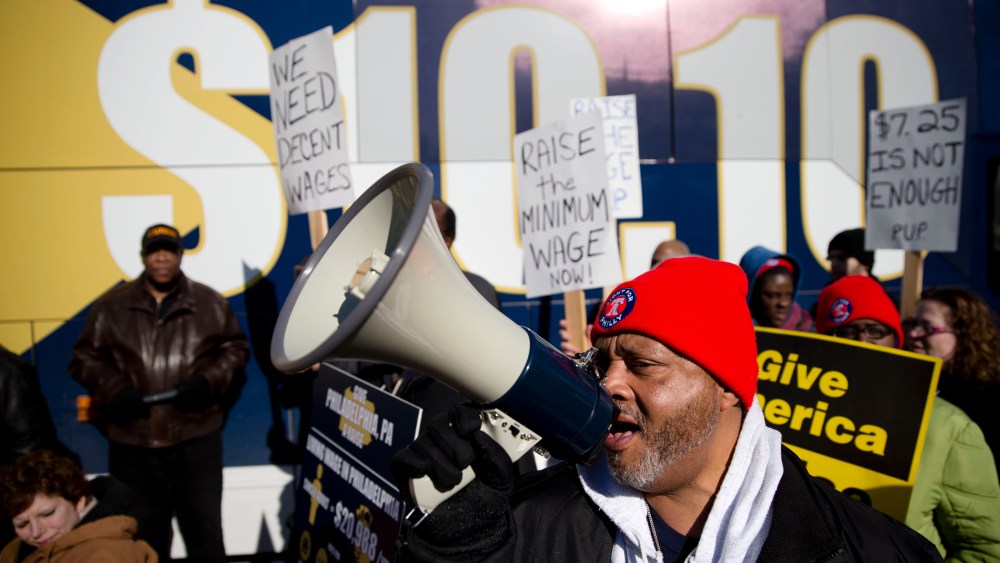 Protestors call for a minimum wage increase, Thursday, March 27, 2014, in Philadelphia.
