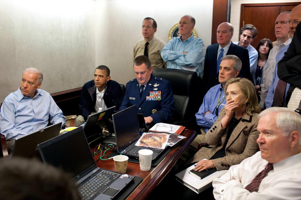 FILE - In this May 1, 2011 image released by the White House and digitally altered by the source to obscure the details of a document on the table, President Barack Obama, second from left, Vice President Joe Biden, left, Secretary of Defense Robert...