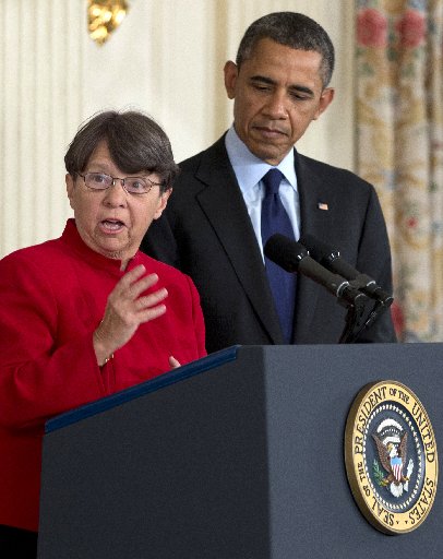 Mary Joe White speaks as President Barack Obama listens in the State Dining Room of the White House in Washington, Thursday, Jan. 24, 2013, after he announced that he will nominate White to lead the Security and Exchange Commission (SEC), and re...