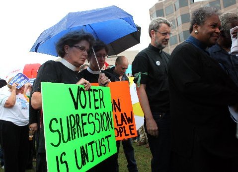 Dozens of demonstrators line up to enter the North Carolina State Legislative Building were they were arrested during an act of civil disobedience opposing the Republican legislature's agenda Monday, June 10, 2013. More than 350 people have been...