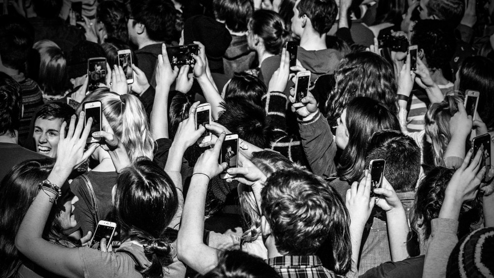Supporters of Senator Bernie Sanders take photographs on their phones at a rally in Iowa City, Ia., Jan. 30, 2016. (Photo by Mark Peterson/Redux for MSNBC)