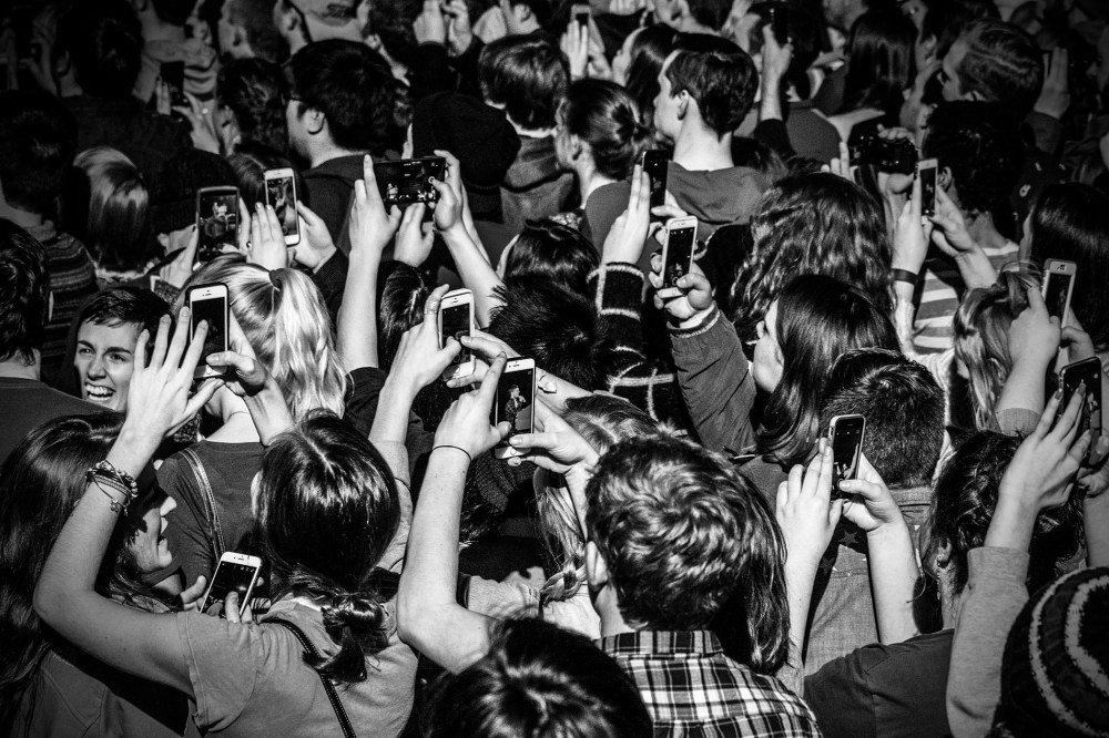 Supporters of Senator Bernie Sanders take photographs on their phones at a rally in Iowa City, Ia., Jan. 30, 2016. (Photo by Mark Peterson/Redux for MSNBC)