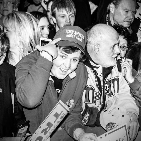 A supporter of Republican presidential candidate Donald Trump points to his hat at a rally in Marshalltown, Iowa, Jan. 26, 2016. (Photo by Mark Peterson/Redux for MSNBC)