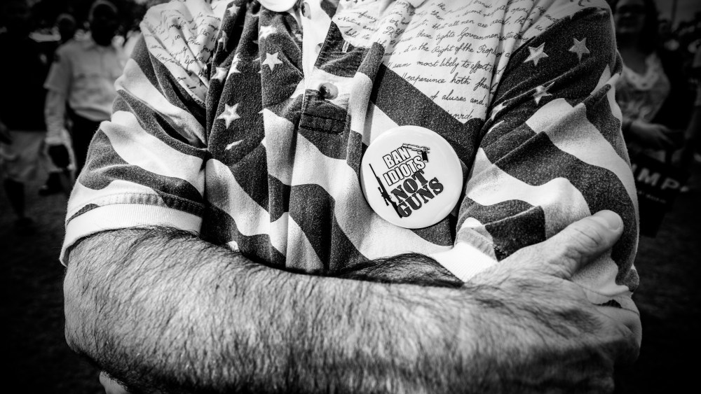 A supporter of Donald Trump wearing a "Ban idiots, not guns" button at a rally in Boca Raton, Fl. (Photo by Mark Peterson/Redux for MSNBC)