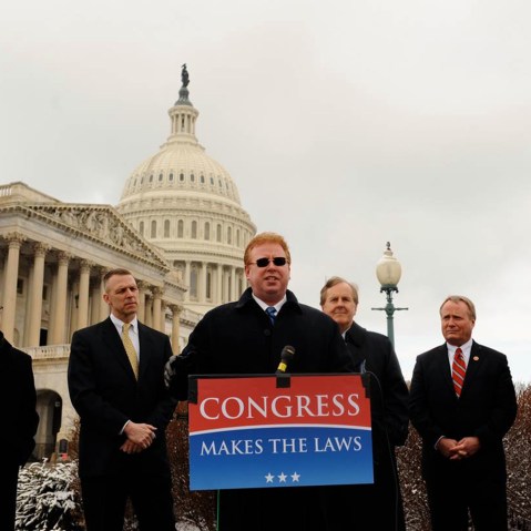 Dr. Larry Kawa, center, speaks about his lawsuit against the IRS regarding the employer mandate in the Affordable Care Act.