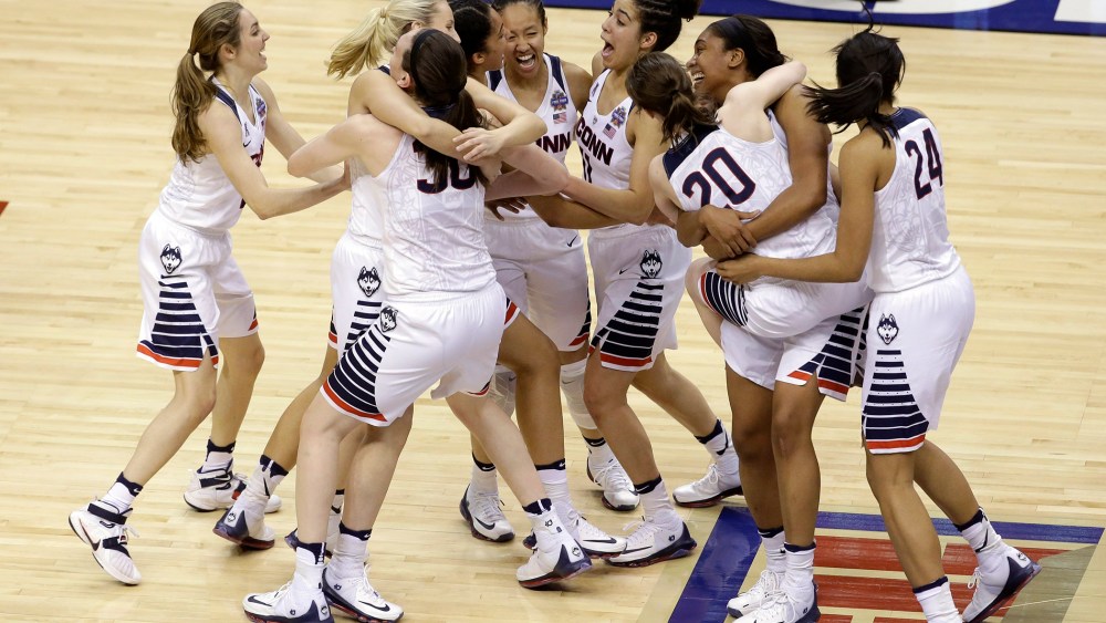 Members of Connecticut celebrate after defeating Syracuse in the championship game at the women's Final Four in the NCAA college basketball tournament, April 5, 2016, in Indianapolis. (Photo by Darron Cummings/AP)