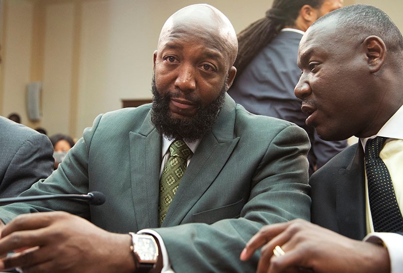 Tracy Martin, father of Trayvon Martin, left, talks to his attorney Benjamin Crump, on Capitol Hill in Washington, Wednesday, July 24, 2013, during a forum entitled "The Status of Black Males: Ensuring Our Boys Mature Into Strong Men."   (Photo by...