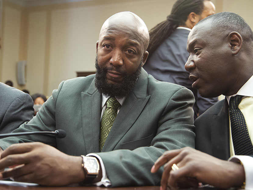 Tracy Martin, father of Trayvon Martin, left, talks to his attorney Benjamin Crump, on Capitol Hill in Washington, Wednesday, July 24, 2013, during a forum entitled "The Status of Black Males: Ensuring Our Boys Mature Into Strong Men." (Photo by...