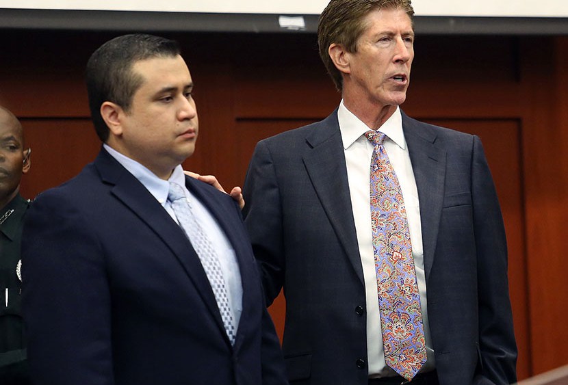 George Zimmerman, left,  stands in the courtroom with defense counsel Mark O'Mara during closing arguments in his trial at the Seminole County Criminal Justice Center, in Sanford, Fla., Friday, July 12, 2013. Photo by Orlando Sentinel/Joe Burbank/Pool/AP