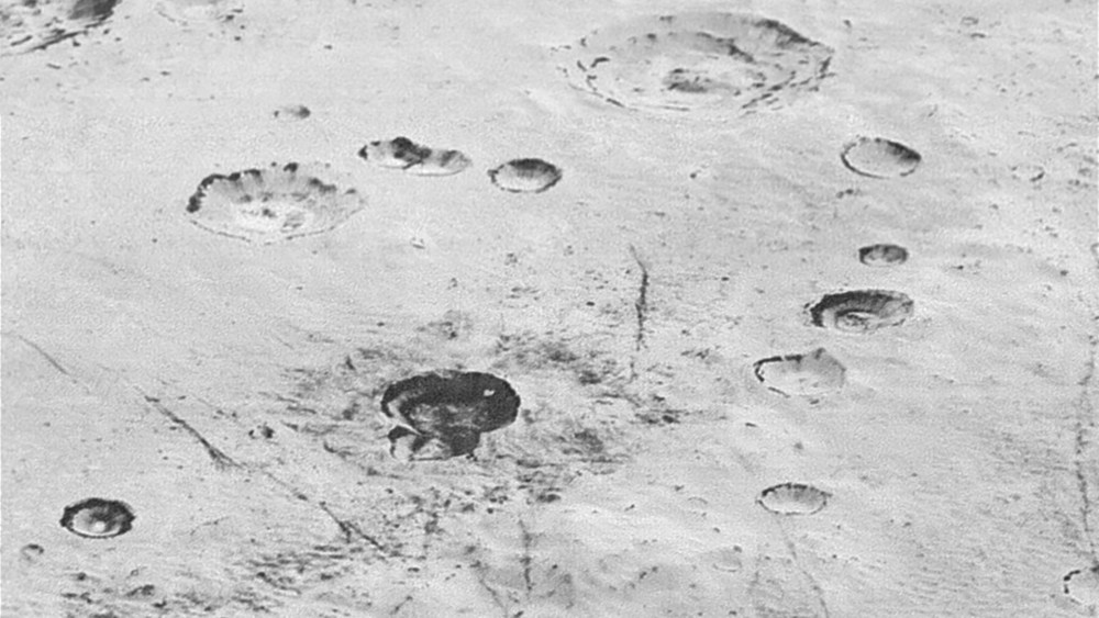 Layered Craters and Icy Plains on Pluto. This image from NASA’s New Horizons spacecraft reveals new details of Pluto’s rugged, icy cratered plains, including layering in the interior walls of many craters. (Photo by NASA/JHUAPL/SwRI)