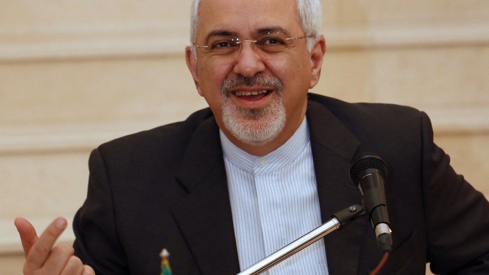 Iranian Foreign Minister Mohammed Javad Zarif  holds a press conference at the Iranian embassy in Muscat following meetings with Omani officials on December 2, 2013.