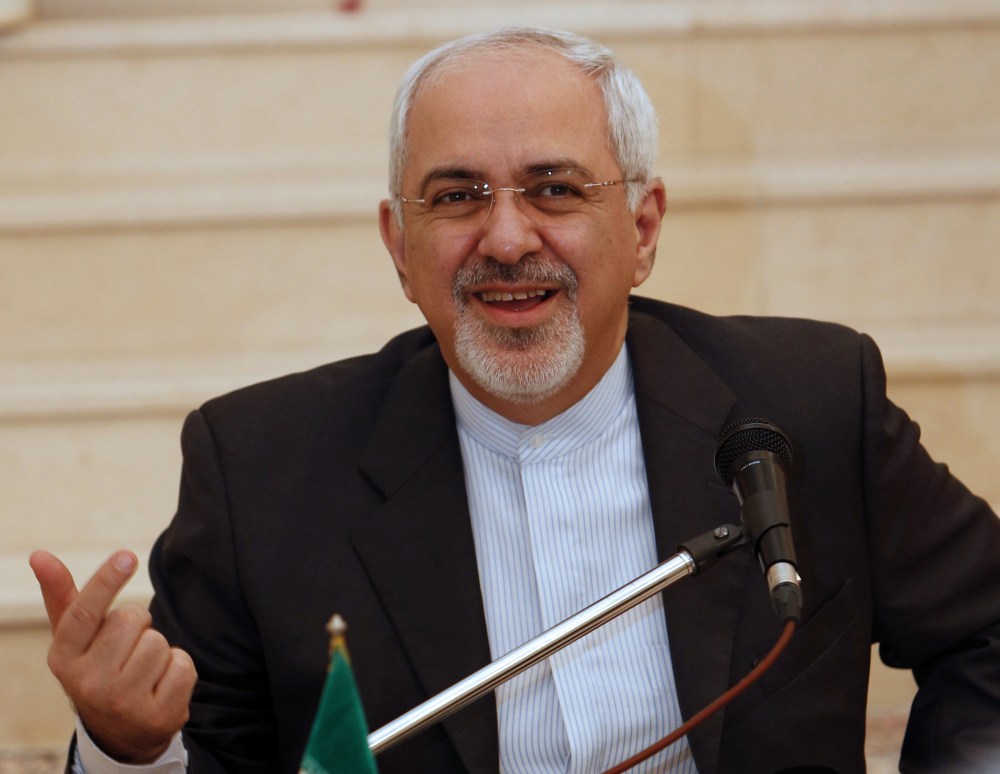 Iranian Foreign Minister Mohammed Javad Zarif  holds a press conference at the Iranian embassy in Muscat following meetings with Omani officials on December 2, 2013.