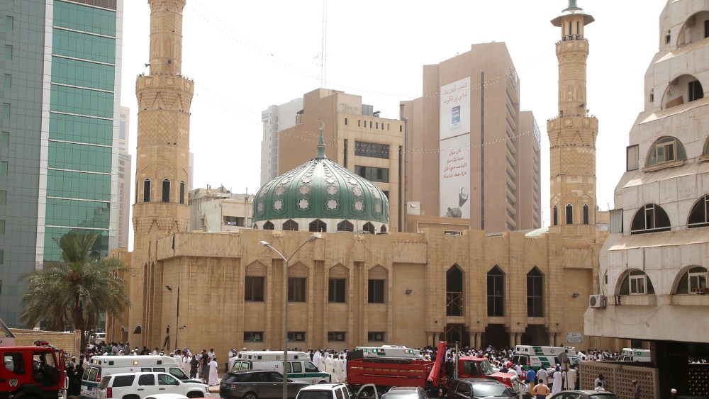 Kuwaiti security forces and emergency personnel gather outside the Shiite Al-Imam al-Sadeq mosque after it was targeted by a suicide bombing during Friday prayers on June 26, 2015, in Kuwait City. (Photo by Yasser Al-Zayyaty/AFP/Getty)