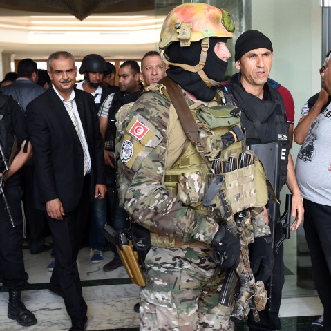 Tunisian security forces stand in front of the Imperial hotel in the resort town of Sousse, a popular tourist destination 140 kilometres (90 miles) south of the Tunisian capital, on June 26, 2015, following a shooting attack. (Fethi Belaid/AFP/Getty)