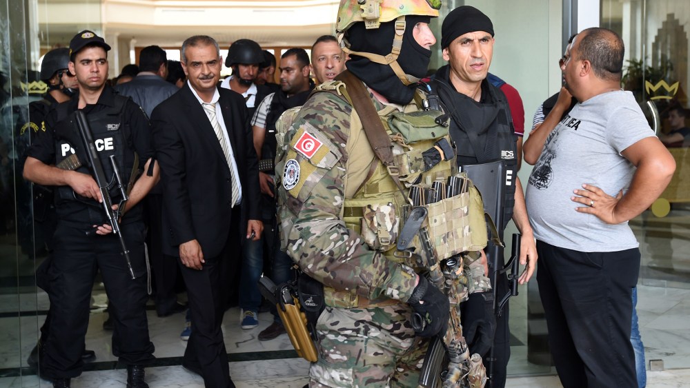 Tunisian security forces stand in front of the Imperial hotel in the resort town of Sousse, a popular tourist destination 140 kilometres (90 miles) south of the Tunisian capital, on June 26, 2015, following a shooting attack. (Fethi Belaid/AFP/Getty)