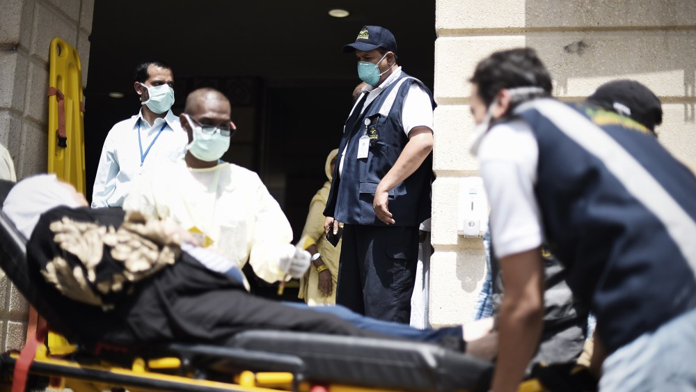 Saudi medics tend to injured pilgrims after they arrived at an emergency hospital following a deadly stampede in Mina, near the holy city of Mecca, on the first day of Eid al-Adha on Sept. 24, 2015. (Photo by Mohammed Al-Shaikh/AFP/Getty)