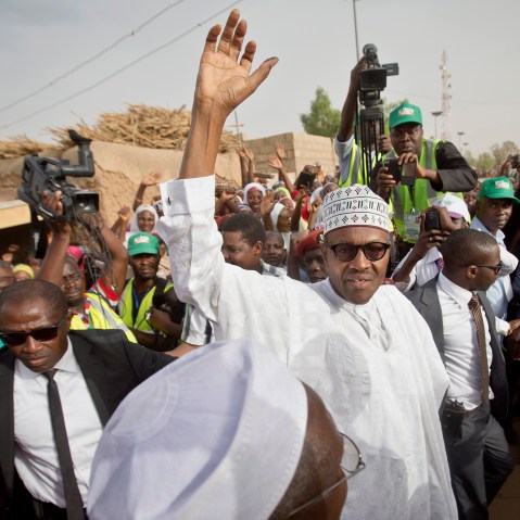 Gen. Muhammadu Buhari waves to supporters after casting his vote in his home town of Daura, northern Nigeria on March 28, 2015. (Photo by Ben Curtis/AP)