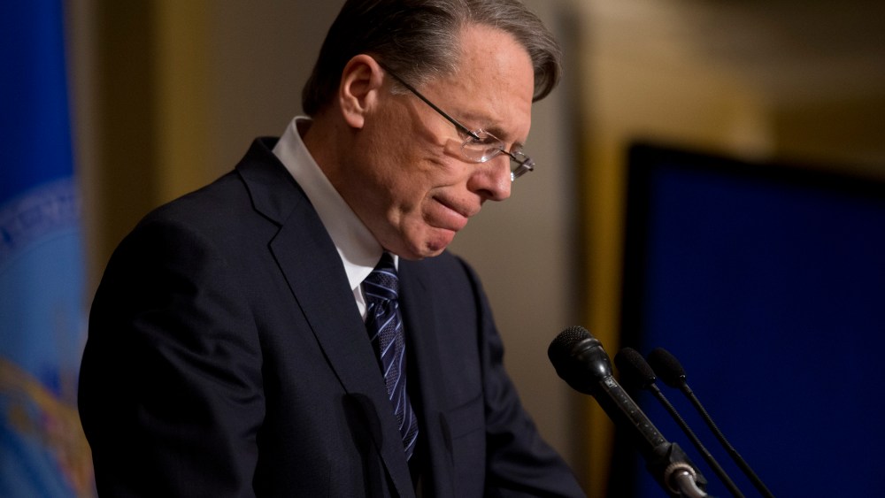 File Photo: National Rifle Association executive vice president Wayne LaPierre pauses as he makes a statement during a news conference in response to the Connecticut school shooting, on Friday, Dec. 21, 2012 (Photo by Evan Vucci/AP)