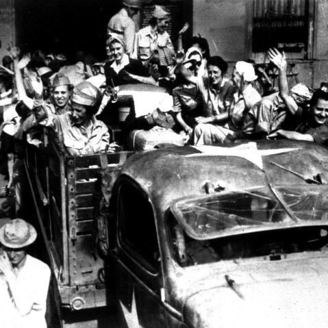 U.S. army nurses, interned since the fall of Corregidor in 1942, wave goodbye to fellow inmates at Santo Tomas, a former Japanese prison camp, in Manila, the Philippines, April 18, 1945. The nurses are returning to their homes and families in the...